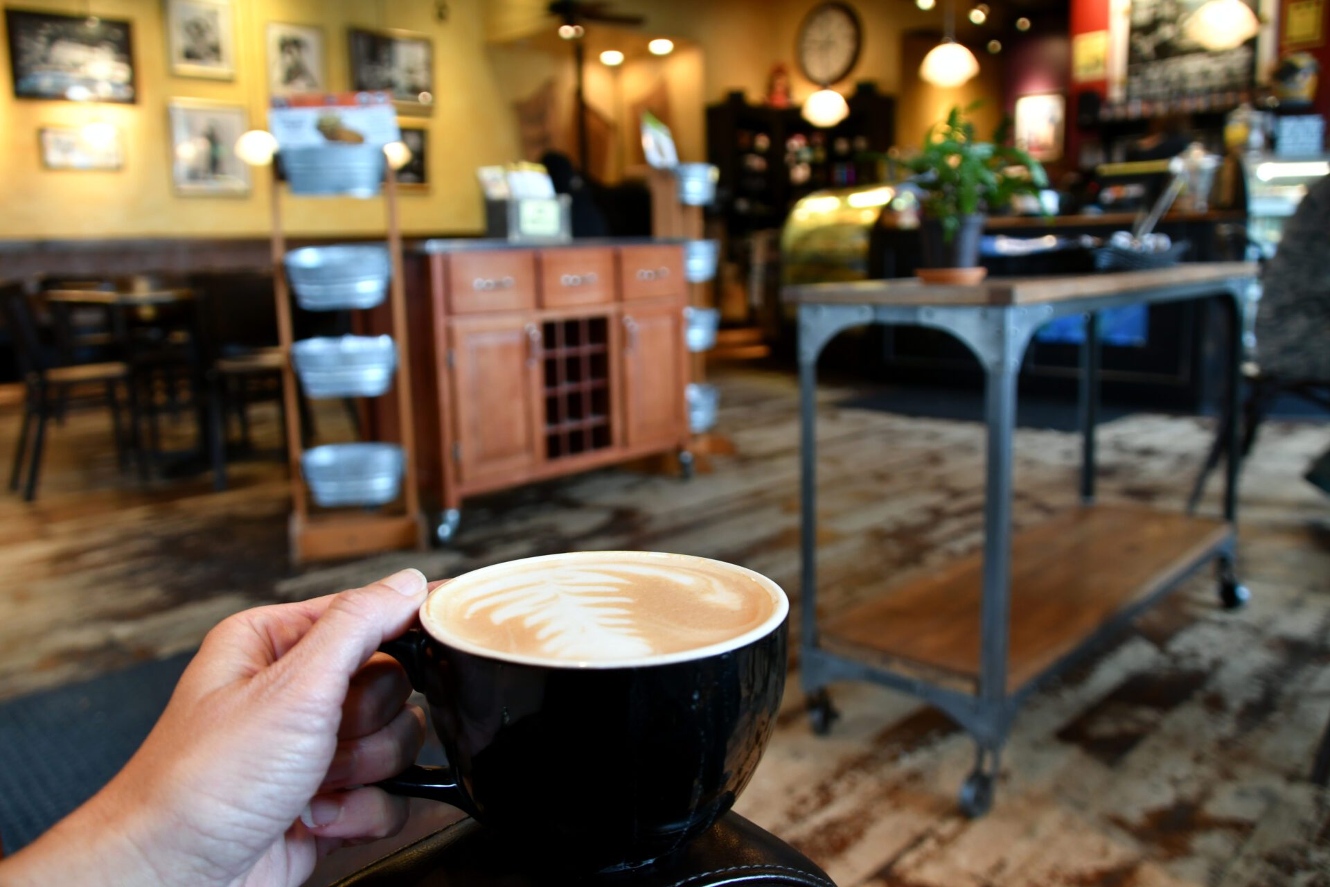 relaxing-in-a-colorful-local-business-coffee-shop-with-a-hot-coffee-latte-real-people-human-element_t20_GG3beE