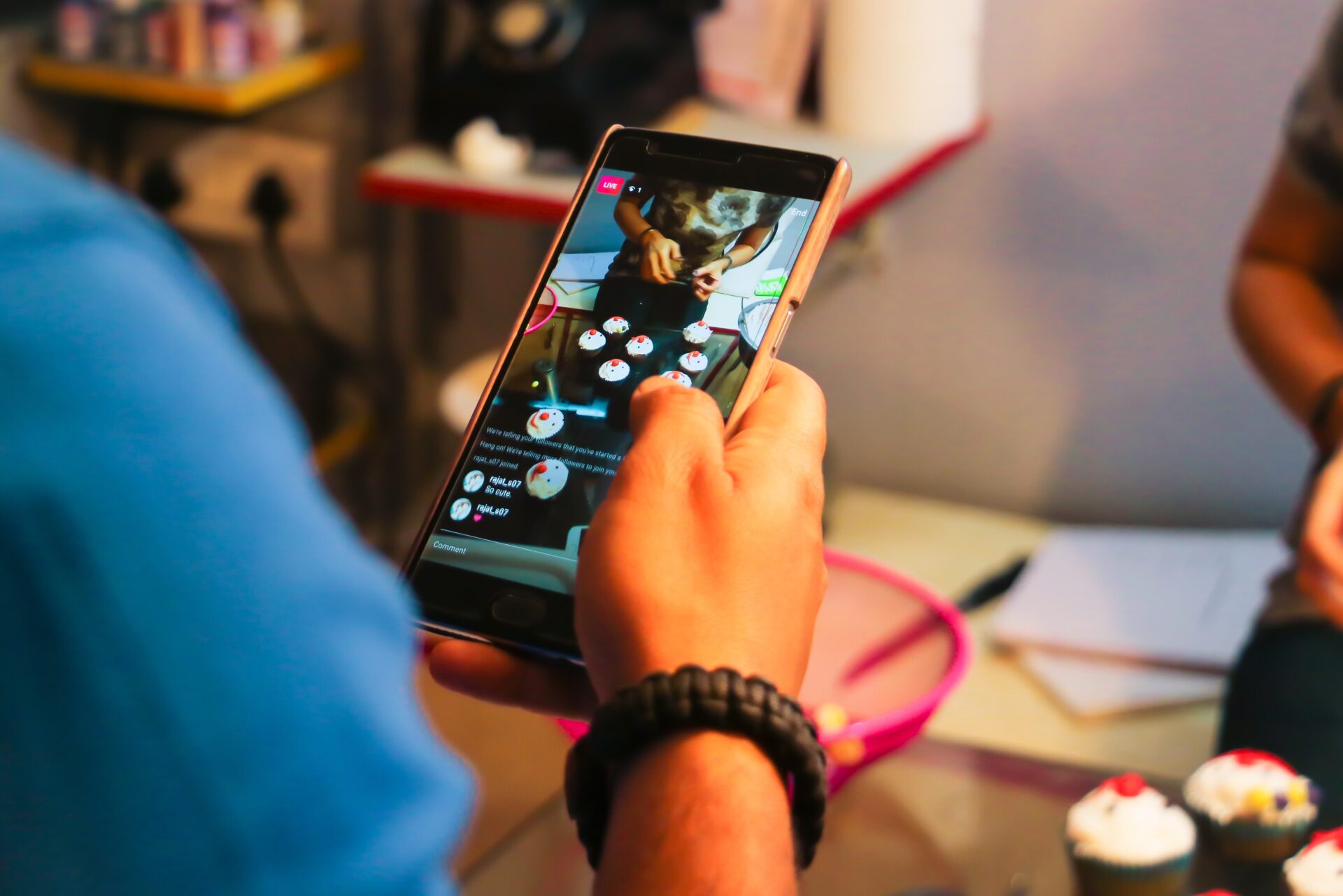 A person holding a cell phone watching a video A person holding a cell phone watching a video